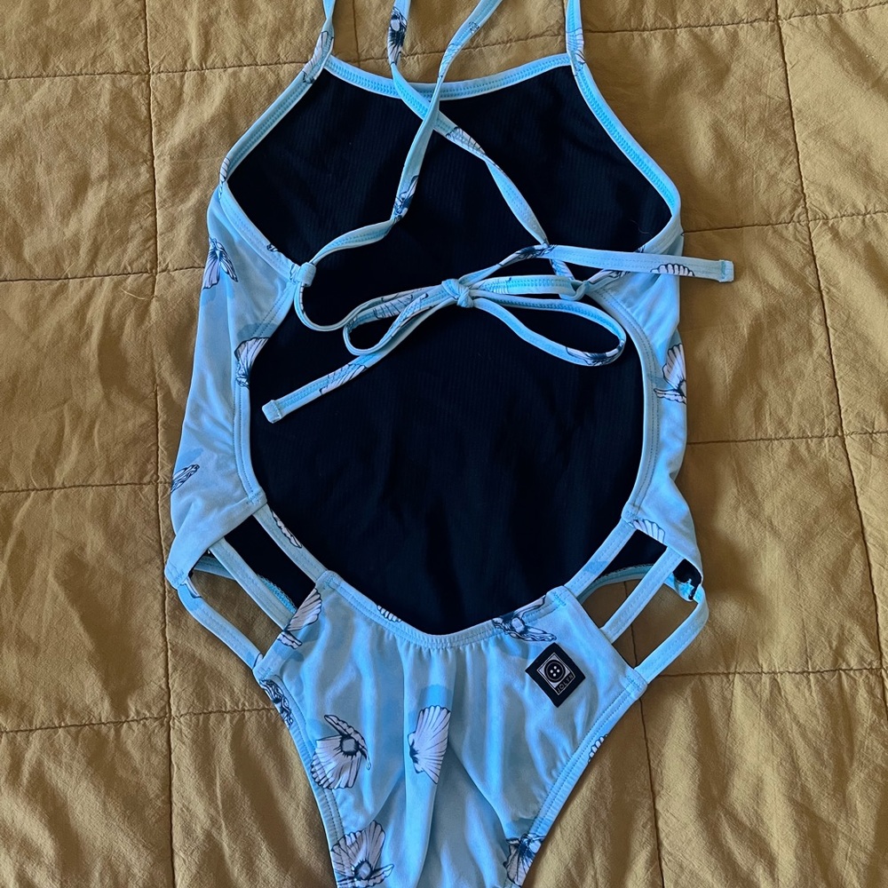 jolyn clothing swim onesie- 26 “shellibration” print